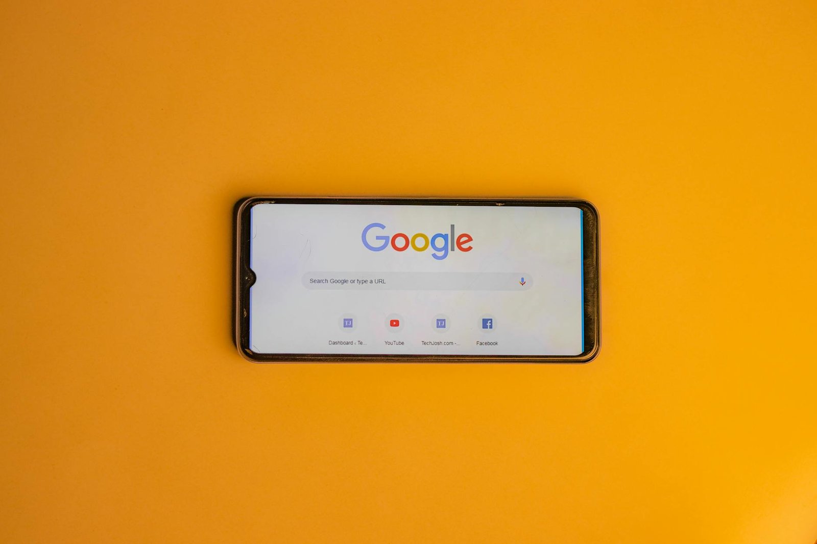 smart phone with a google search page on its display
