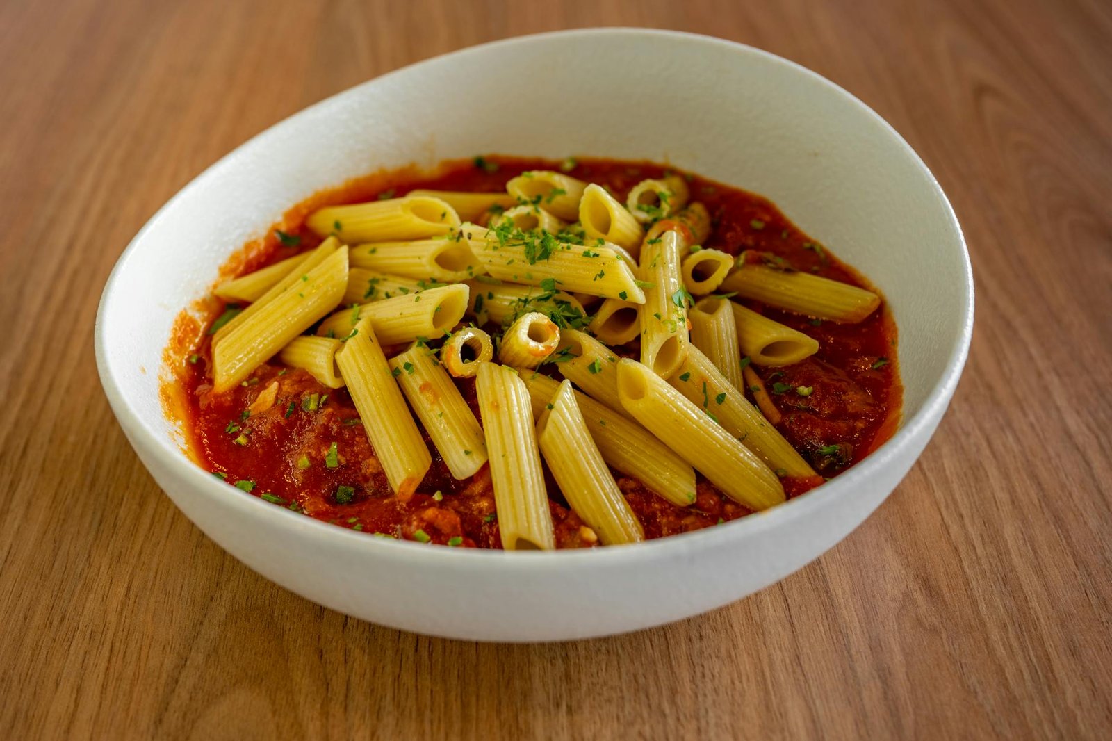 delicious penne pasta in rich tomato sauce