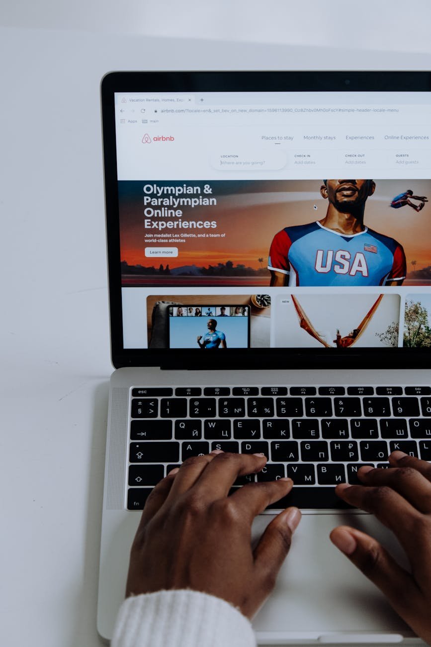 macbook pro displaying man in blue shirt