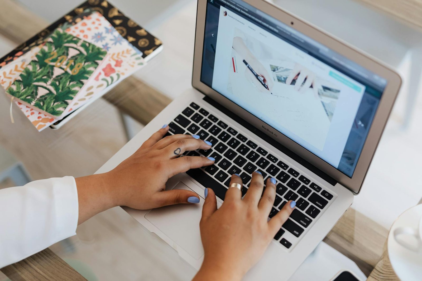 close up view of person using a laptop