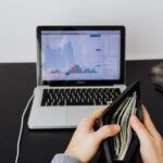 a person holding his wallet