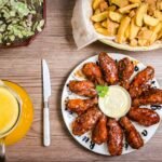 saucy fried chicken on a plate
