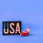 a car figurine with american flag